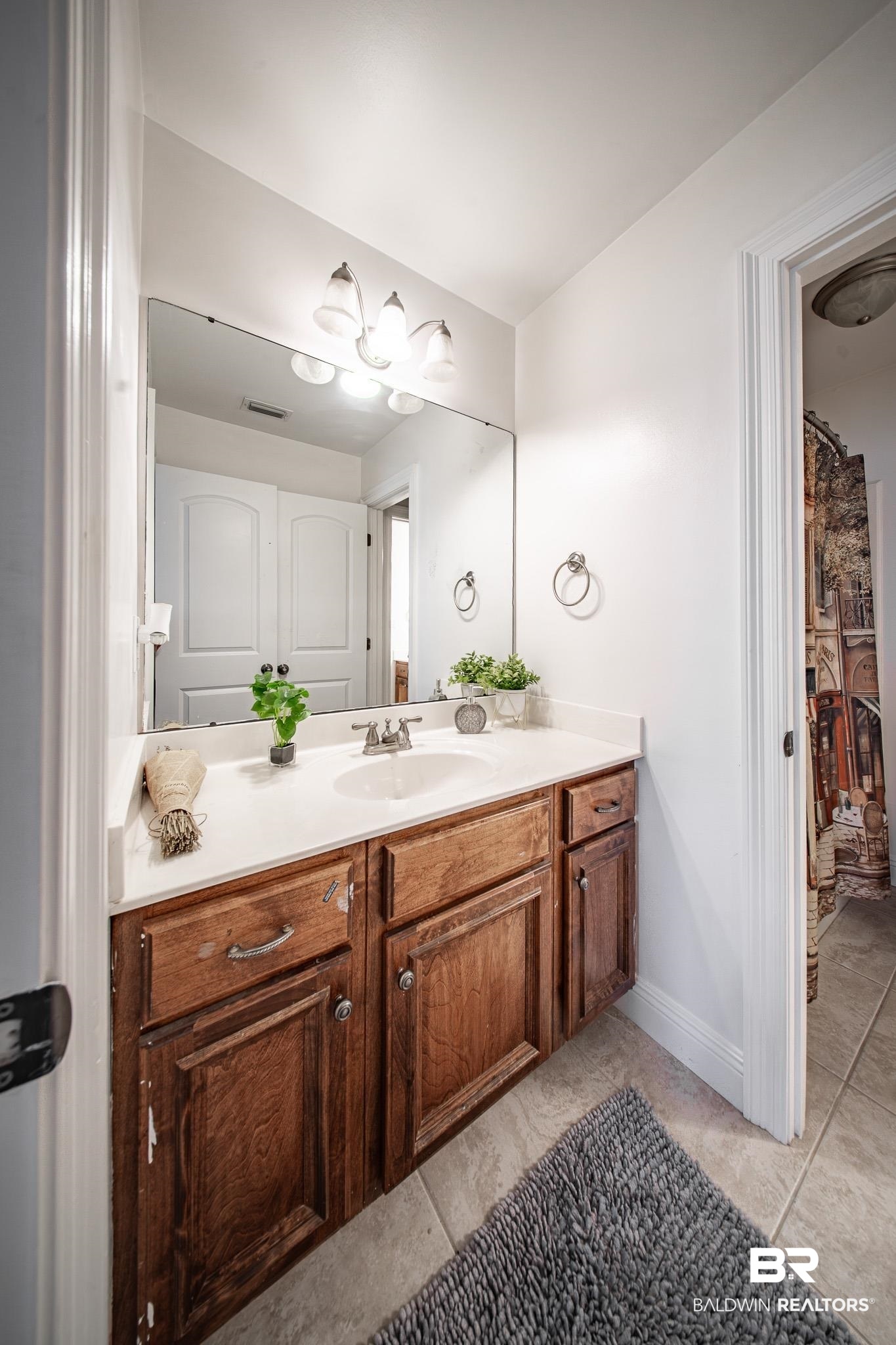 8421 Weatherford Court Daphne, AL 36527 - Photo 25 of 36 Bathroom featuring vanity and tile patterned flooring