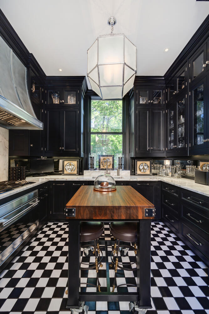 1500 North Astor Street, Unit 6 Chicago, IL 60610 - Photo 22 of 39 a kitchen with a sink a stove and wooden cabinets