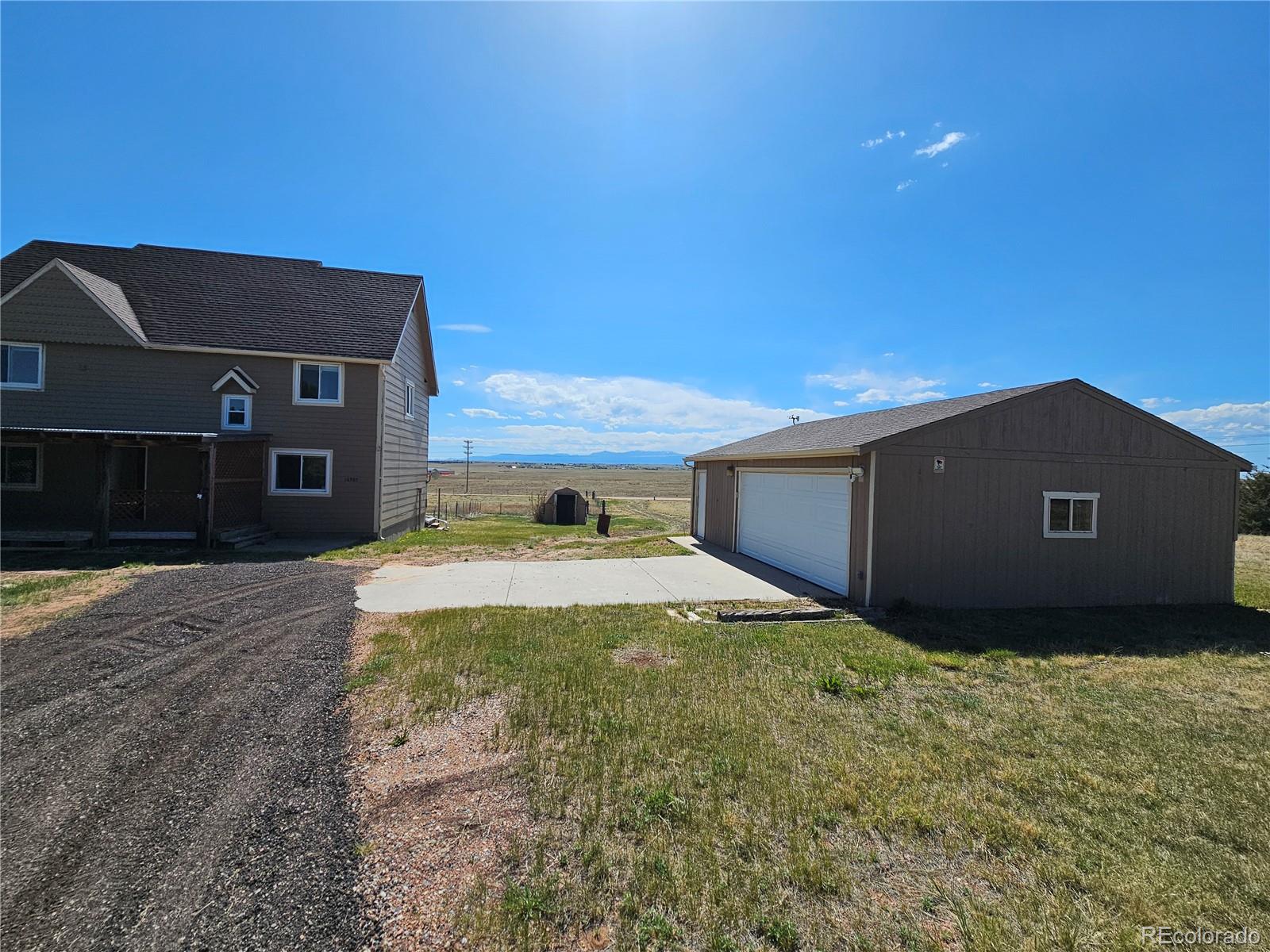 16985 Sage Crest Road Peyton, CO 80831 - Photo 3 of 25 a view of a house with a yard
