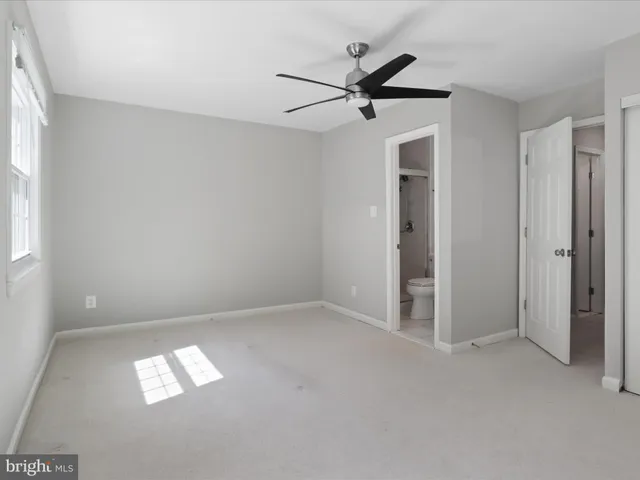 a view of empty room with windows