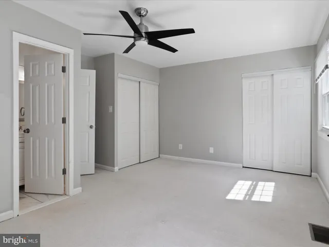 a view of an empty room and a window