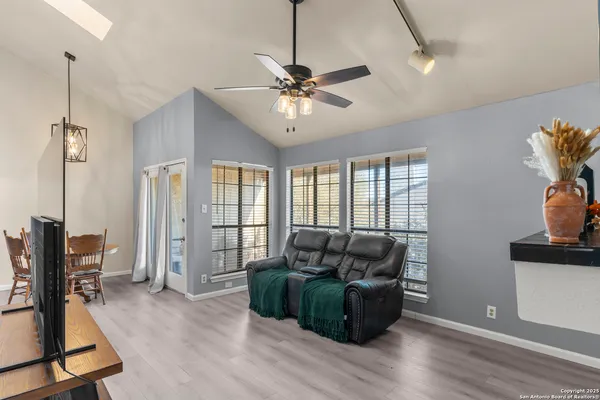 a living room with furniture and a window