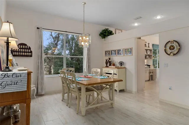 a view of a dining room with furniture window and outside view