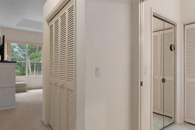 a spacious bathroom with a double vanity sink mirror and bathtub