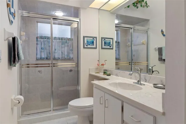 a view of a chair and table in the backyard