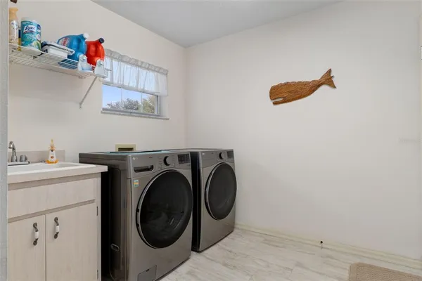 a house that has a tree in front of it