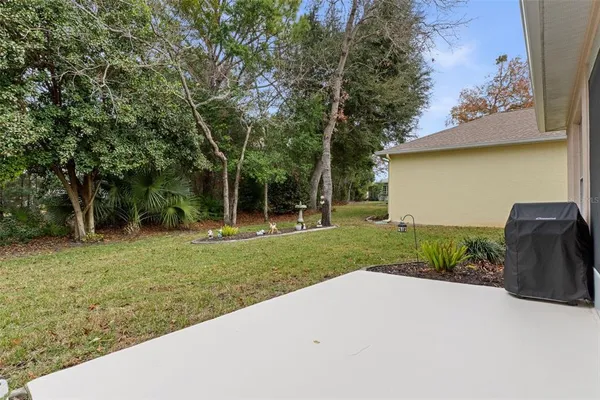 a view of a house with swimming pool and sitting area