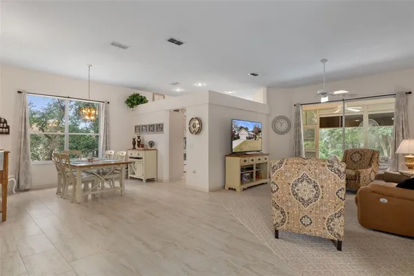 a living room with furniture window and wooden floor