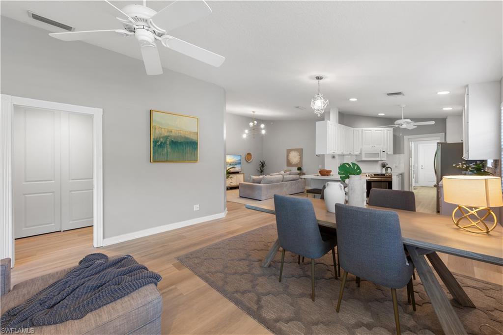 3238 Barbados Lane Naples, FL 34119 - Photo 15 of 43 a view of a dining room with furniture