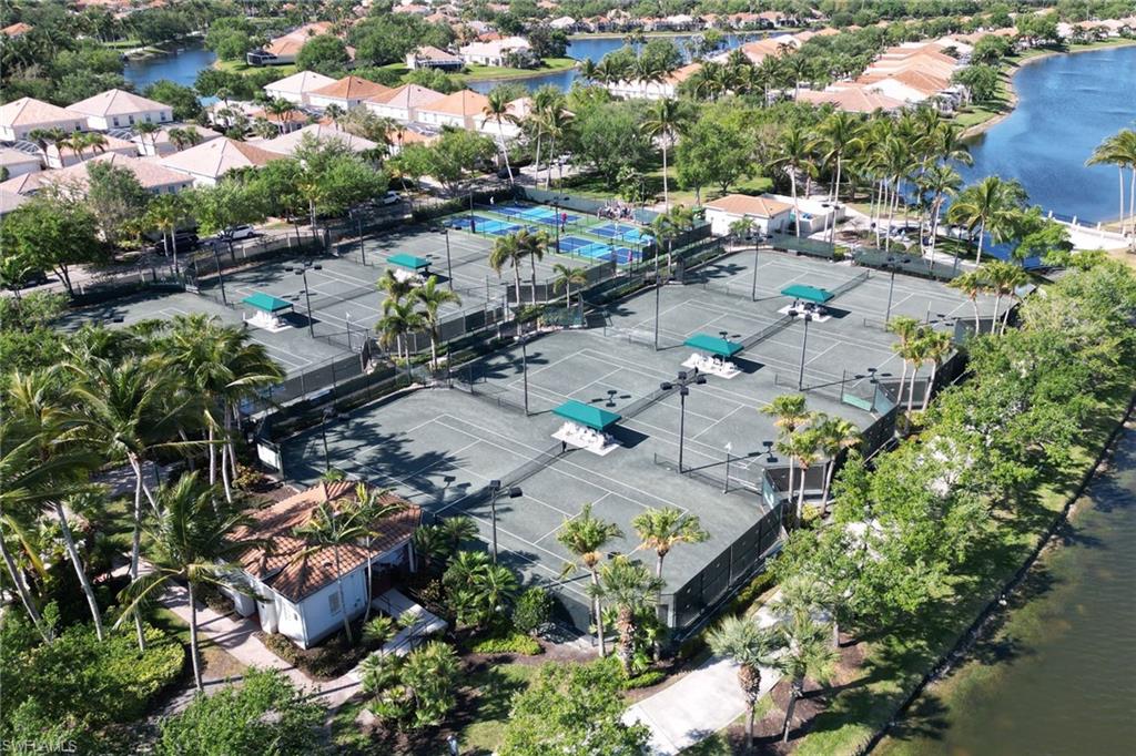 3238 Barbados Lane Naples, FL 34119 - Photo 38 of 43 an aerial view of a city with lots of residential buildings