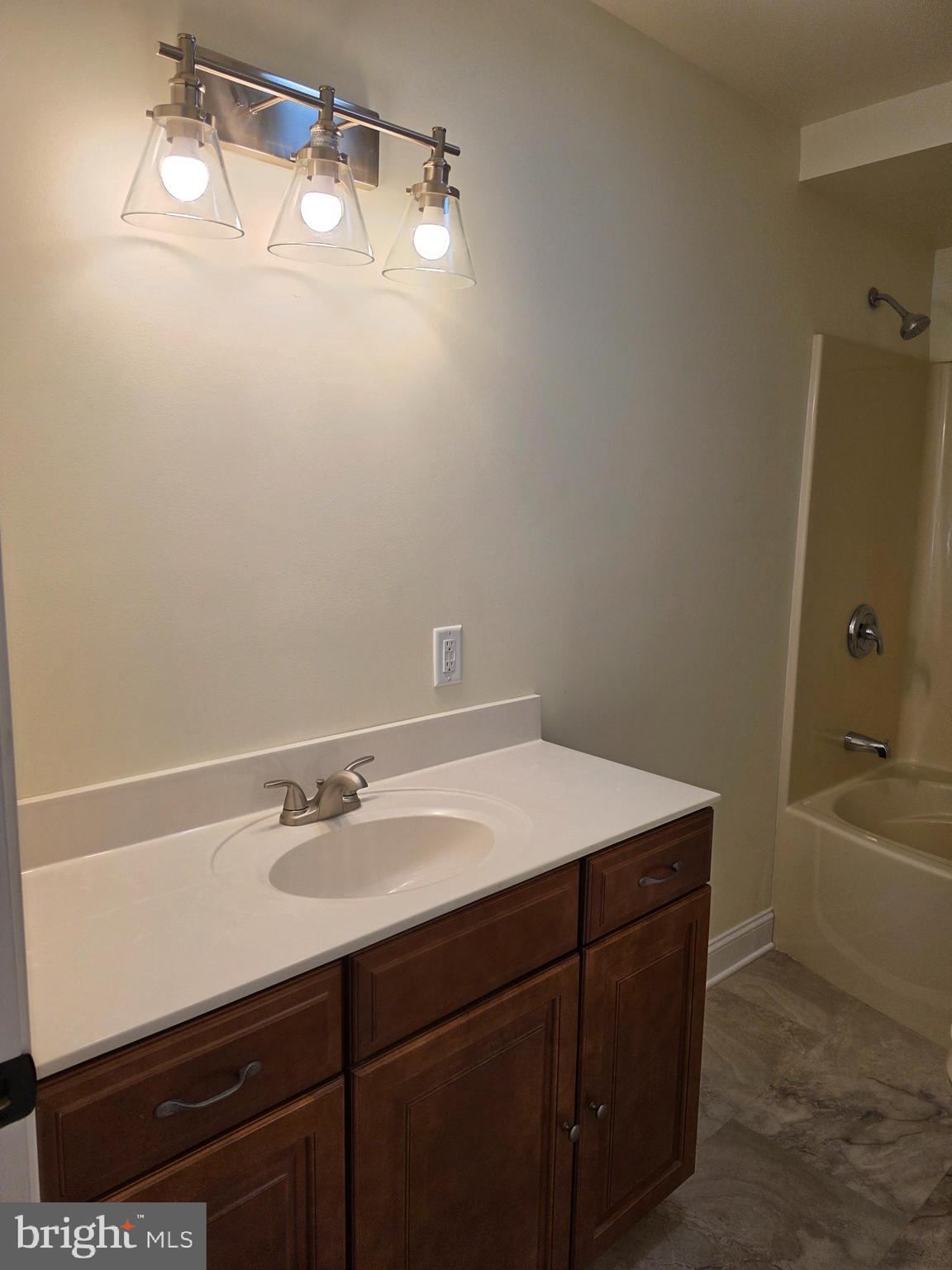 13514 Old Cresaptown Road Southwest Lavale, MD 21502 - Photo 19 of 25 a bathroom with a sink a vanity and a bathtub
