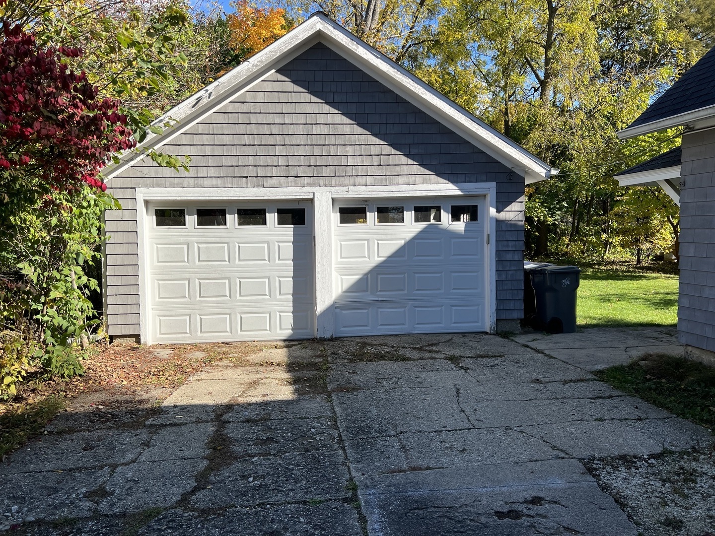 833 Prospect Street Elgin, IL 60120 - Photo 2 of 20 a front view of a house with a yard and garage