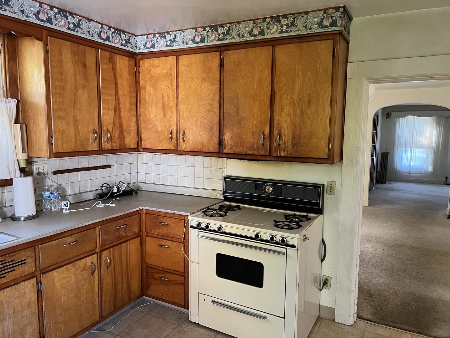 833 Prospect Street Elgin, IL 60120 - Photo 7 of 20 a kitchen with a sink a stove and cabinets