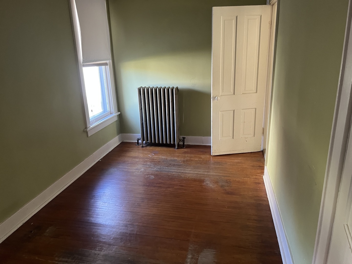 833 Prospect Street Elgin, IL 60120 - Photo 9 of 20 an empty room with wooden floor and windows
