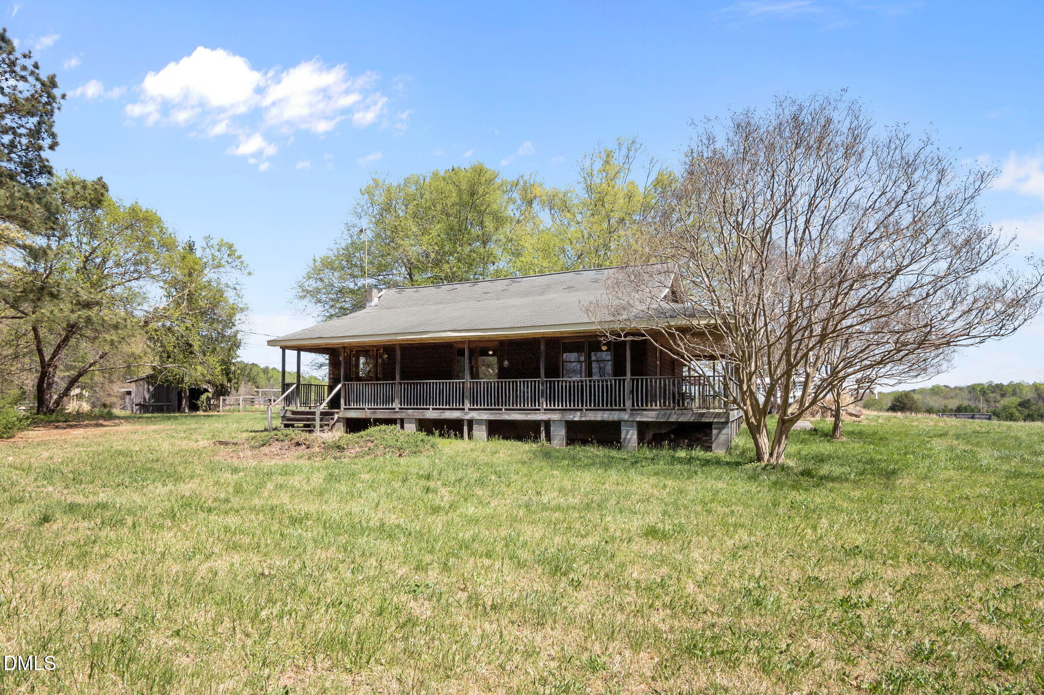 212 Thomas Humphries Road Roxboro, NC 27574 - Photo 47 of 56 a backyard of a house with table and chairs