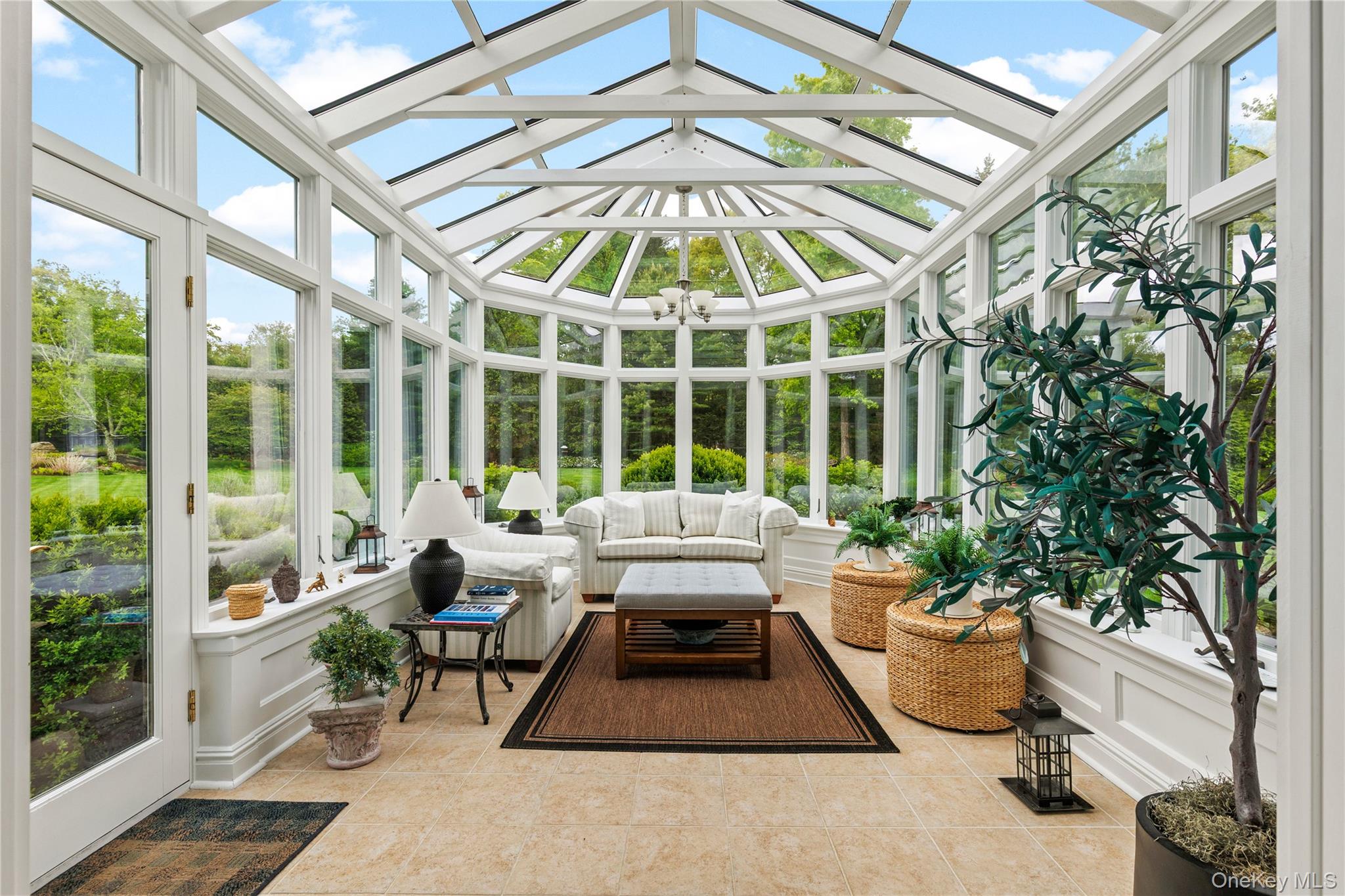 63 Old Mill River Road Pound Ridge, NY 10576 - Photo 12 of 47 a building outdoor space with patio furniture and potted plants