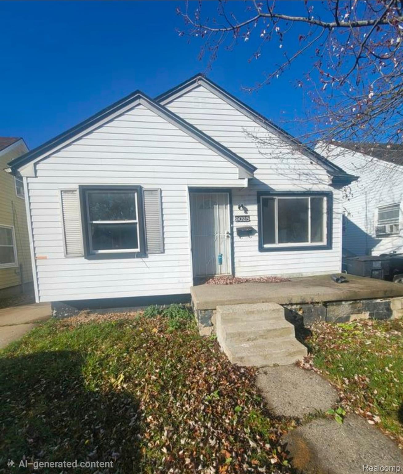 9025 Burt Road Detroit, MI 48228 - Photo 1 of 12 White siding exterior with a dark trim around windows and main entry