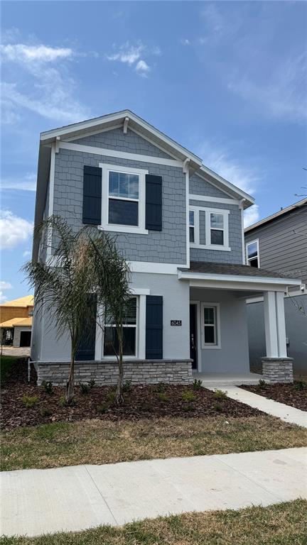a front view of a house with garage