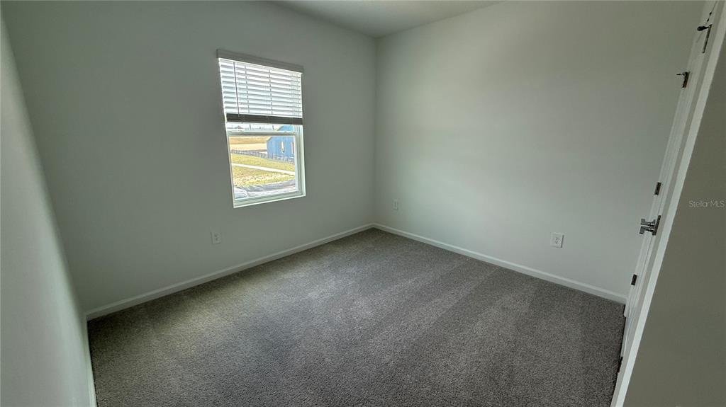 6045 Wellbeing Way Clermont, FL 34714 - Photo 11 of 19 an empty room with a window