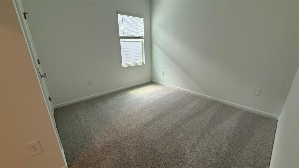 6045 Wellbeing Way Clermont, FL 34714 - Photo 14 of 19 an empty room with windows