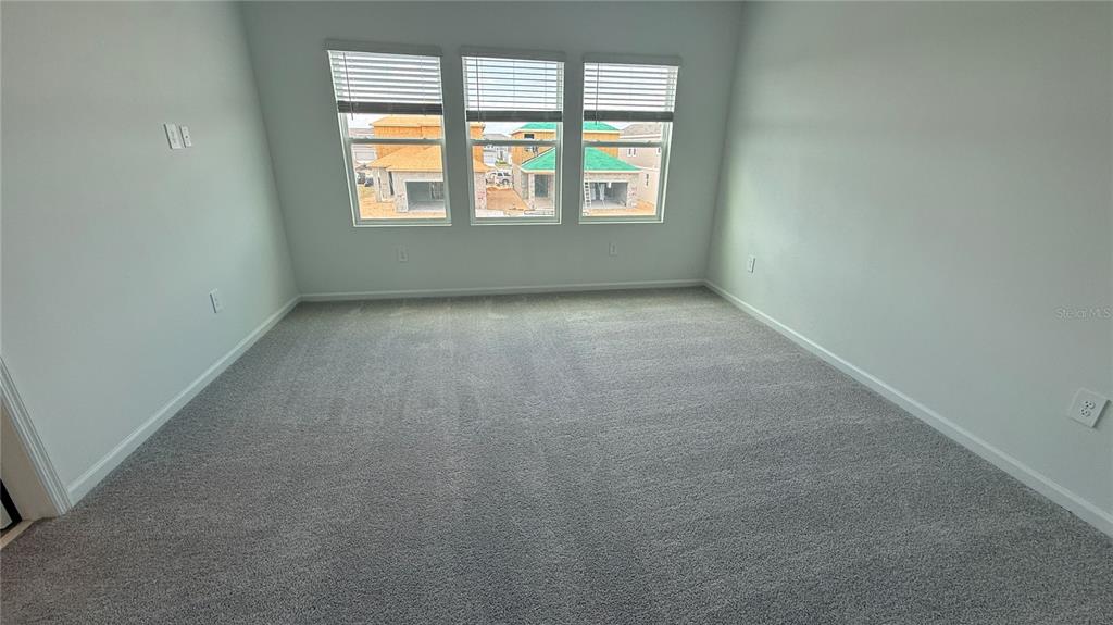 6045 Wellbeing Way Clermont, FL 34714 - Photo 16 of 19 an empty room with a window