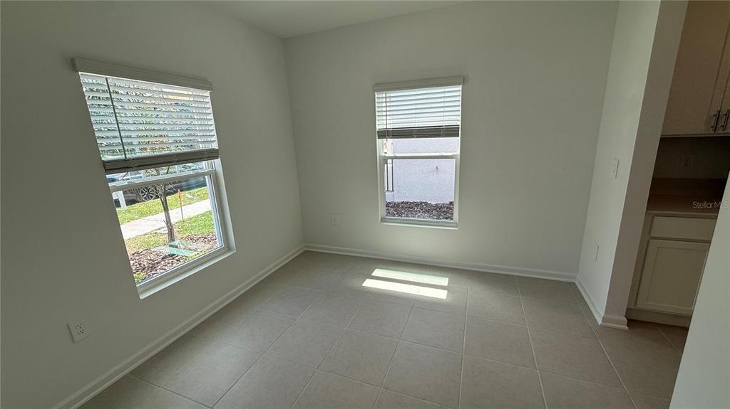 6045 Wellbeing Way Clermont, FL 34714 - Photo 3 of 19 an empty room with windows