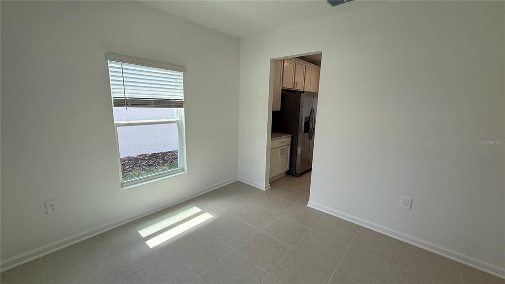 6045 Wellbeing Way Clermont, FL 34714 - Photo 4 of 19 an empty room with windows