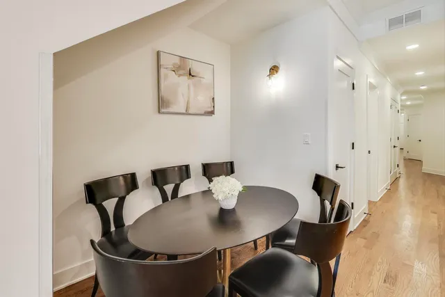 a spacious bedroom with a bed and a table