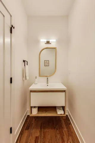 a bathroom with a shower and a sink