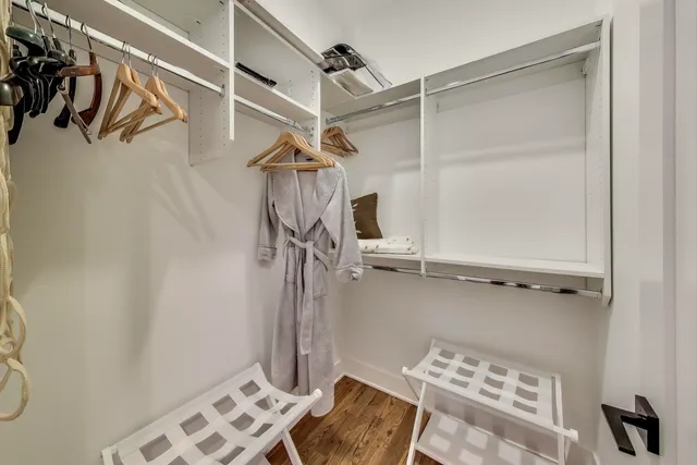 a bedroom with a bed and a table