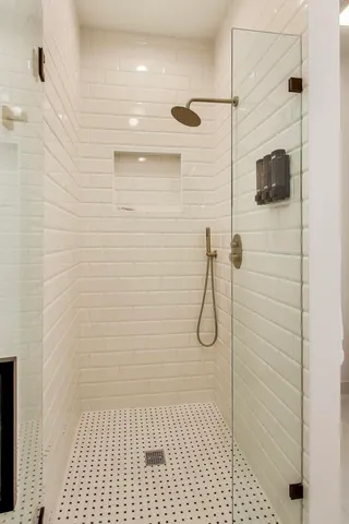 a spacious bedroom with two beds and a large window