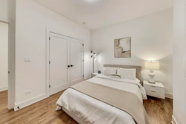 a bed room with a bed and a television