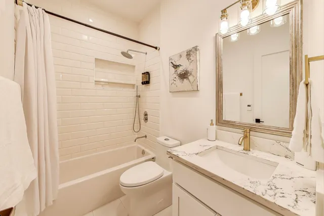 a view of a porch with furniture and floor to ceiling windows