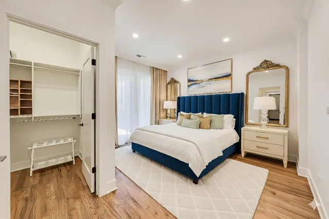 a bedroom with a bed and a view of bedroom