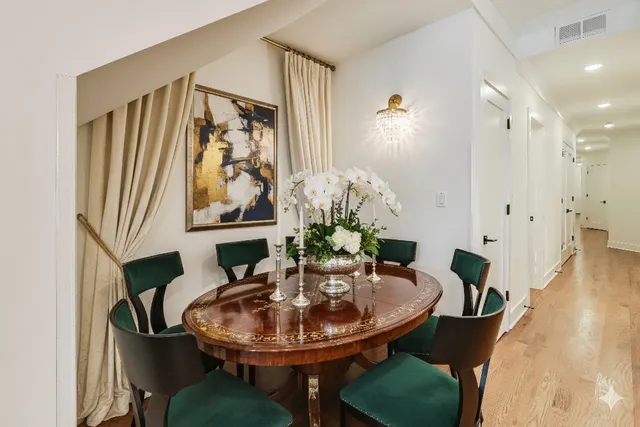 a dining room with furniture and wooden floor