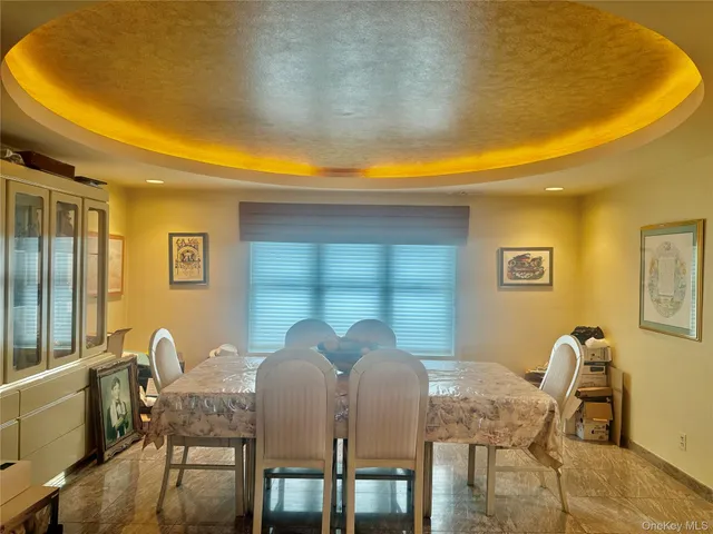 a view of a dining room with furniture and window