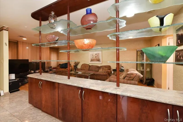 a kitchen with a sink a counter space and stainless steel appliances