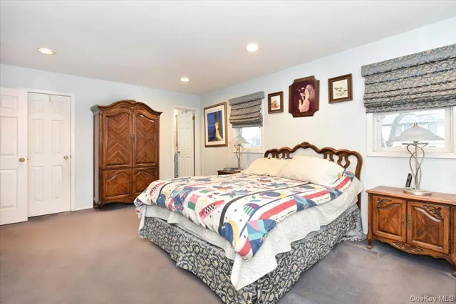 a bedroom with bed and window