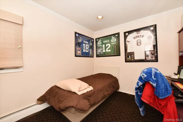 a living room with furniture and wall paintings