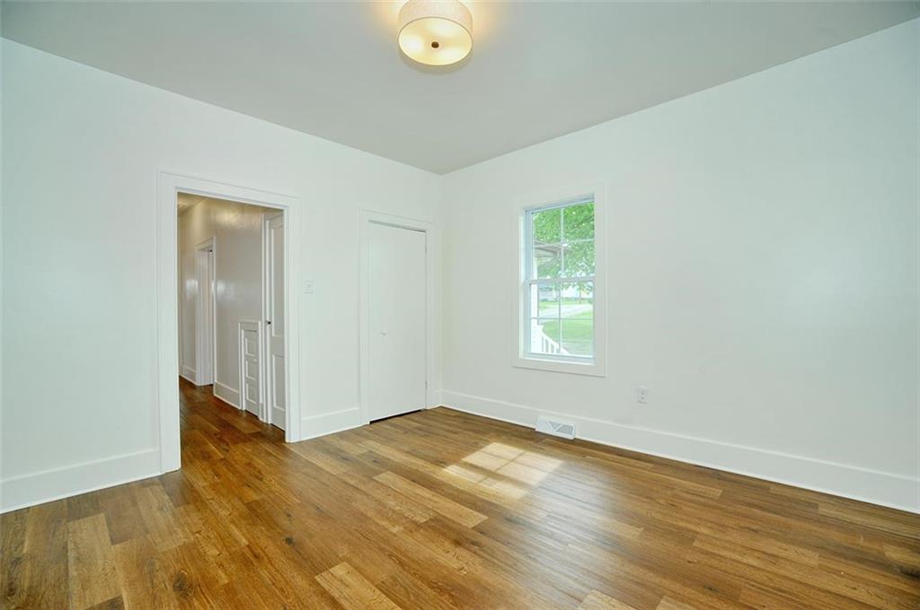 113 3rd Street Houston, PA 15342 - Photo 16 of 27 an empty room with wooden floor and windows