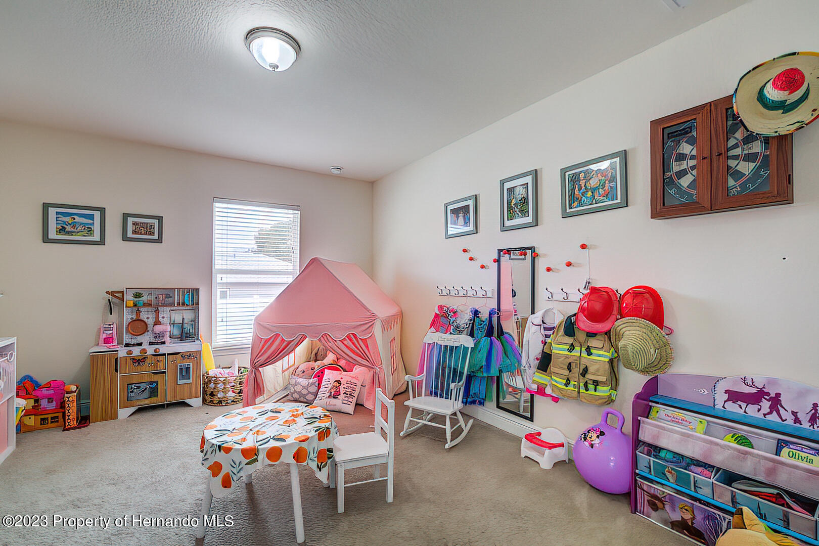 8140 Jasbow Junction Weeki Wachee, FL 34613 - Photo 16 of 37 a children room with toys and a couch