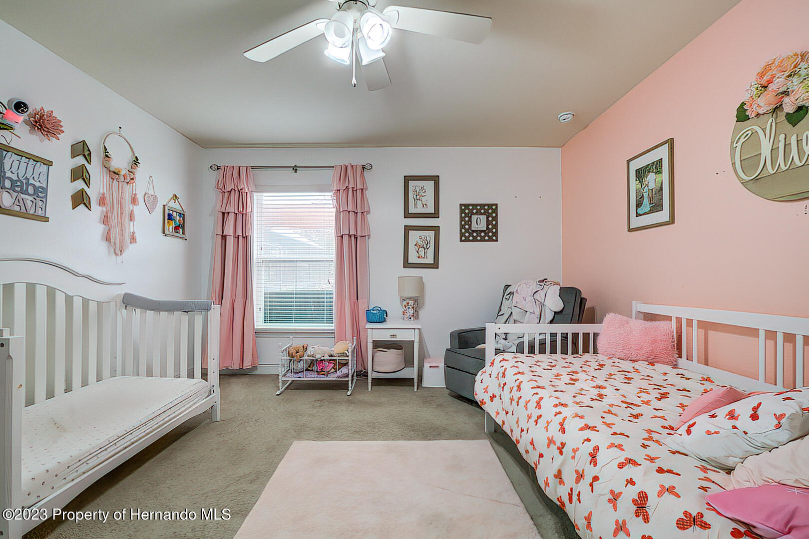 8140 Jasbow Junction Weeki Wachee, FL 34613 - Photo 20 of 37 a bedroom with a bed and a couch