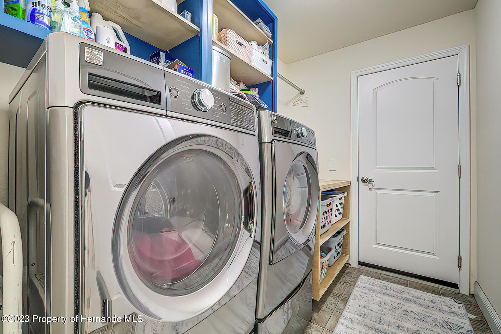 8140 Jasbow Junction Weeki Wachee, FL 34613 - Photo 22 of 37 a utility room with dryer and washer