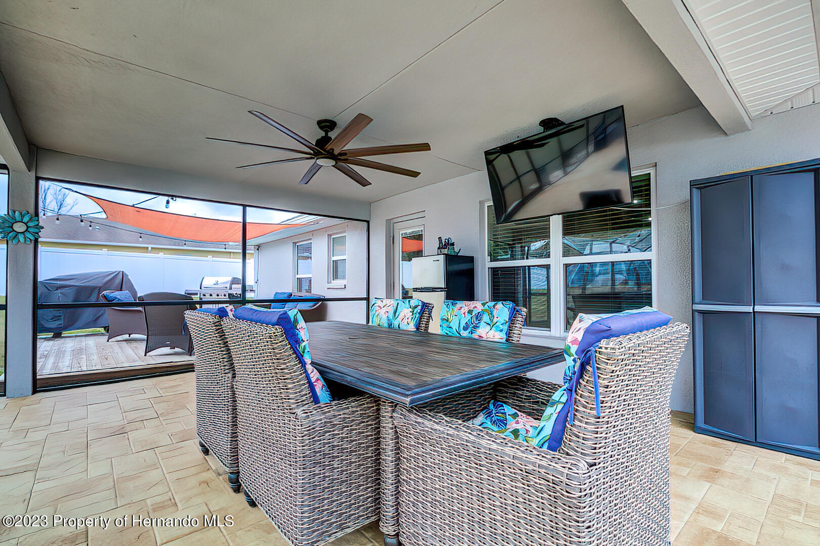 8140 Jasbow Junction Weeki Wachee, FL 34613 - Photo 27 of 37 a dining room with furniture and a floor to ceiling window