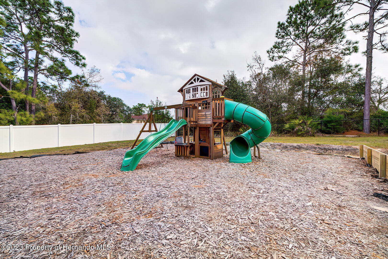 8140 Jasbow Junction Weeki Wachee, FL 34613 - Photo 34 of 37 a view of outdoor space with playground and green space