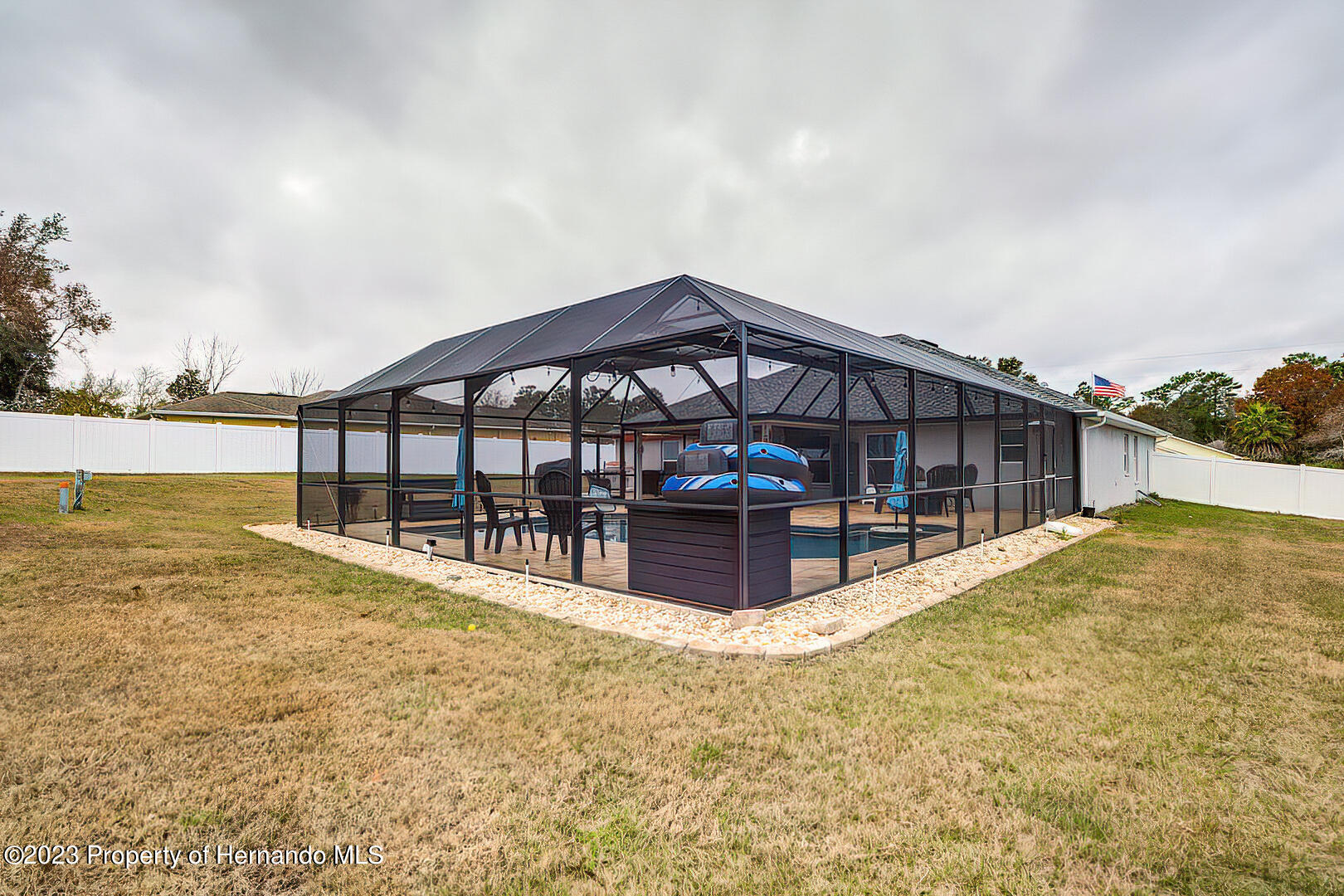 8140 Jasbow Junction Weeki Wachee, FL 34613 - Photo 36 of 37 a view of a house with a yard and sitting area