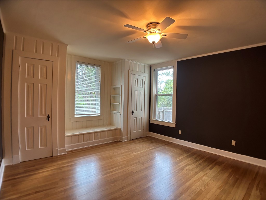 5808 Coventry Lane Austin, TX 78723 - Photo 14 of 27 an empty room with wooden floor and windows