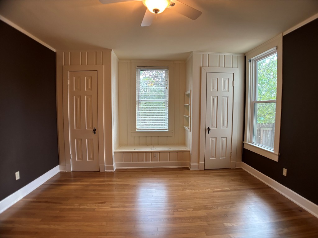 5808 Coventry Lane Austin, TX 78723 - Photo 15 of 27 an empty room with wooden floor and windows