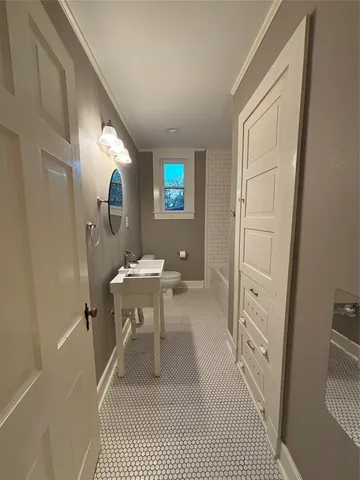 a view of a bathroom with sink and mirror