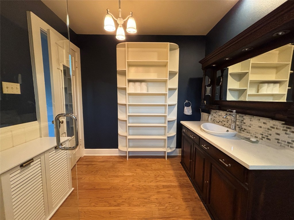 5808 Coventry Lane Austin, TX 78723 - Photo 23 of 27 a bathroom with a sink and a mirror